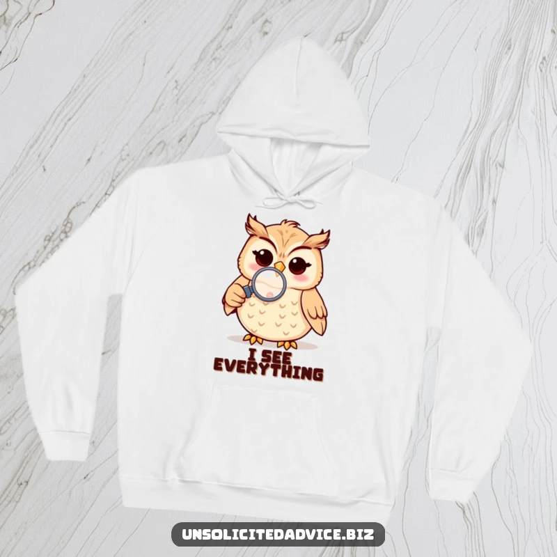 Funny hoodie featuring a cheerful anthropomorphic owl using a magnifying glass to inspect something small, offering cozy curiosity.
